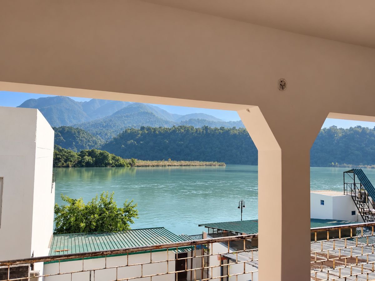 Ganges and forested hills seen through the Room 1 veranda opening